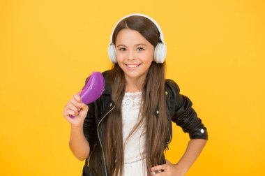 Live it. singer leather jacket. child listen rock music. school radio dj. hipster urban style girl. kid in headset. small girl sing favorite song. imagine you are pop star. singing karaoke clipart