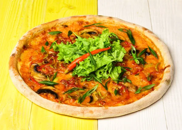 Take away food with crunchy edges. Spicy pizza with salad