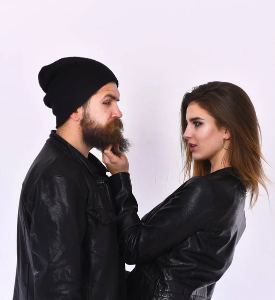 Rock and street life concept. Girl and bearded man