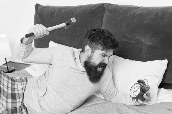 stop ringing. bearded man hipster want to sleep. hate noise of alarm clock. Stages of sleep. Man awake unhappy with alarm clock ringing. Sleep longer. Healthy sleep concept. need more relax in bed