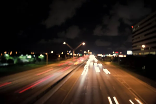 Blurred night city lights. defocused speed background. blur night life. illumination. Abstract urban night light defocused background. Nightscape Fuzzy. Abstract background of city in motion blur — Stock Photo, Image