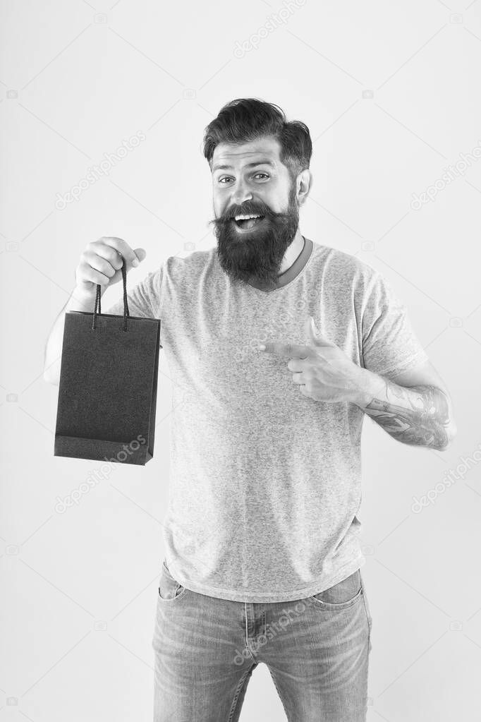 goods for men. Man with package. cyber monday concept. little pleasantness. bearded man go shopping. store for men. mature male beard with purchase. happy hipster hold red paperbag. best offer