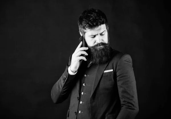 Searching for right decision. Bearded man with smartphone. brutal caucasian hipster. businessman in suit. Male formal fashion. business communication. Mature hipster with beard speak on phone — Stock Photo, Image