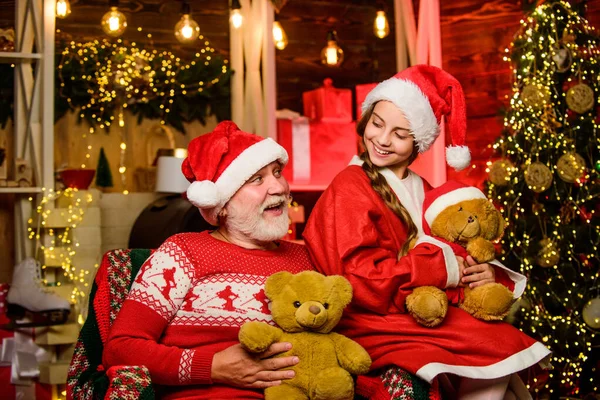 Father and daughter love christmas. grandpa and grandchild at home. family holiday weekend. Little girl with santa man. happy new year. never much toy. xmas happiness and joy. Present for kid — Stock Photo, Image