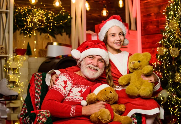 Happy childhood. Family home. Family time. Family tradition concept. Boxing day. Visiting grandparents. Child enjoy christmas with Santa claus. Granddaughter spend time with grandpa. Christmas eve — Stock Photo, Image