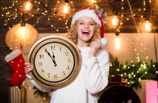 Make wish. Happy emotional girl Santa hat hold vintage clock. Time to celebrate. Merry christmas. Time for winter party. Time for celebration. Few minutes left. New year countdown. Midnight concept — Stok fotoğraf
