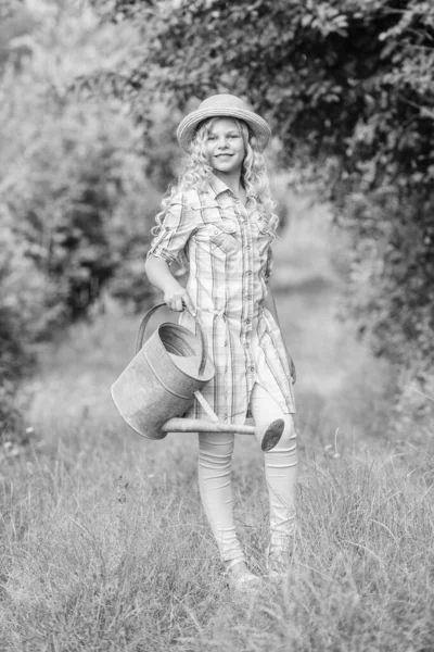 I love my job. summer season. small girl with watering can. earth day. environment ecology. nature protection. little girl farmer care plants. farming and agriculture. spring country side village — Stock Photo, Image