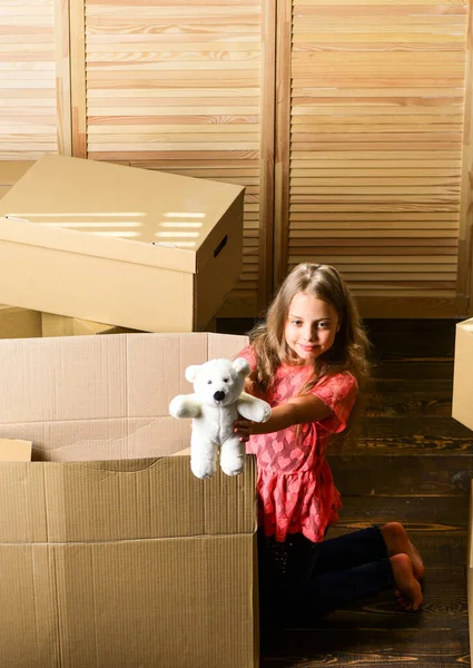 Box package and storage. Small child prepare toys for relocation. Happy childhood. Relocating family stressful for kids. Kid girl relocating boxes background. Relocating concept. Delivery service — Stock Photo, Image