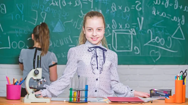 Girls study chemistry in school. Microscope test tubes chemical reactions. Pupils at chalkboard. Fascinating science. Formal education school. Educational experiment. Back to school. School classes — Stock Photo, Image