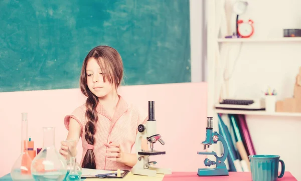 Researches in science laboratory. science lesson with microscope. school laboratory. Modern technology. girl study chemistry with test tube. small girl with flask. back to school. biology education — Stock Photo, Image
