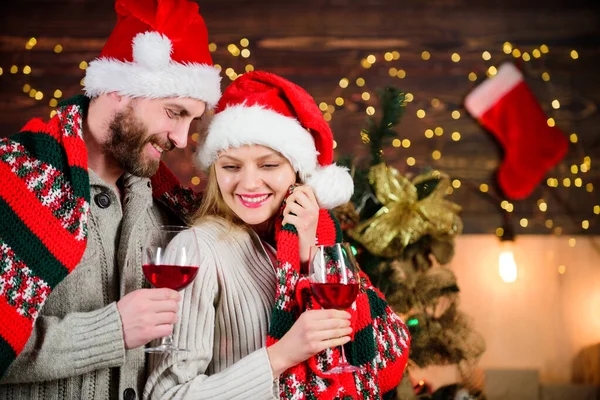 Loving hearts. Man woman lovely celebrating new year. Celebrating winter holiday. Couple in love enjoy red wine. Romantic celebration. Merry christmas. Celebrating together. Dearest people concept
