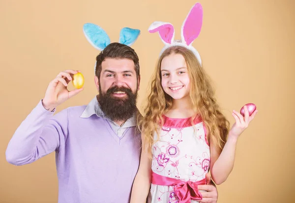 Happy easter. Holiday bunny long ears. Family tradition concept. Family dad and daughter wear bunny ears. Father and child celebrate easter. Spring holiday. Easter day. Easter activities for children