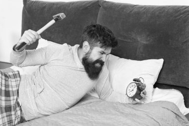 expressing anger. need more relax in bed. bearded man hipster want to sleep. hate noise of alarm clock. Stages of sleep. Man awake unhappy with alarm clock ring. Sleep longer. Healthy sleep concept clipart