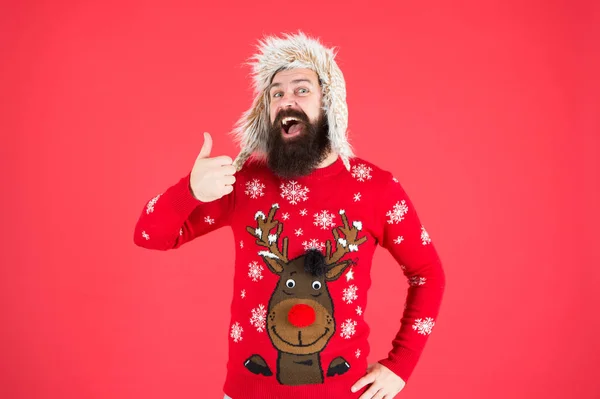 Loving cold weather. Happy new year. Join party. Winter outfit. Christmas sweater. Cheerful hipster bearded man wear christmas jumper and hat. Christmas tradition. Christmas spirit and vibe — Stock Photo, Image