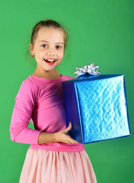 New Year presents concept. Lady holds blue gift for Christmas.