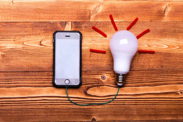 Gadget and idea symbol. Mobile phone and light bulb