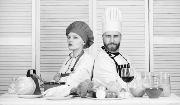 Cooking with your spouse can strengthen relationships. Woman and bearded man culinary partners. Ultimate cooking challenge. Reasons why couples cooking together. Couple compete in culinary arts