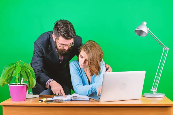 woman and man work in office at laptop. businessman and assistant solve problem. data. Team brainstorming. business couple at computer. secretary with boss at workplace. Successful team at work