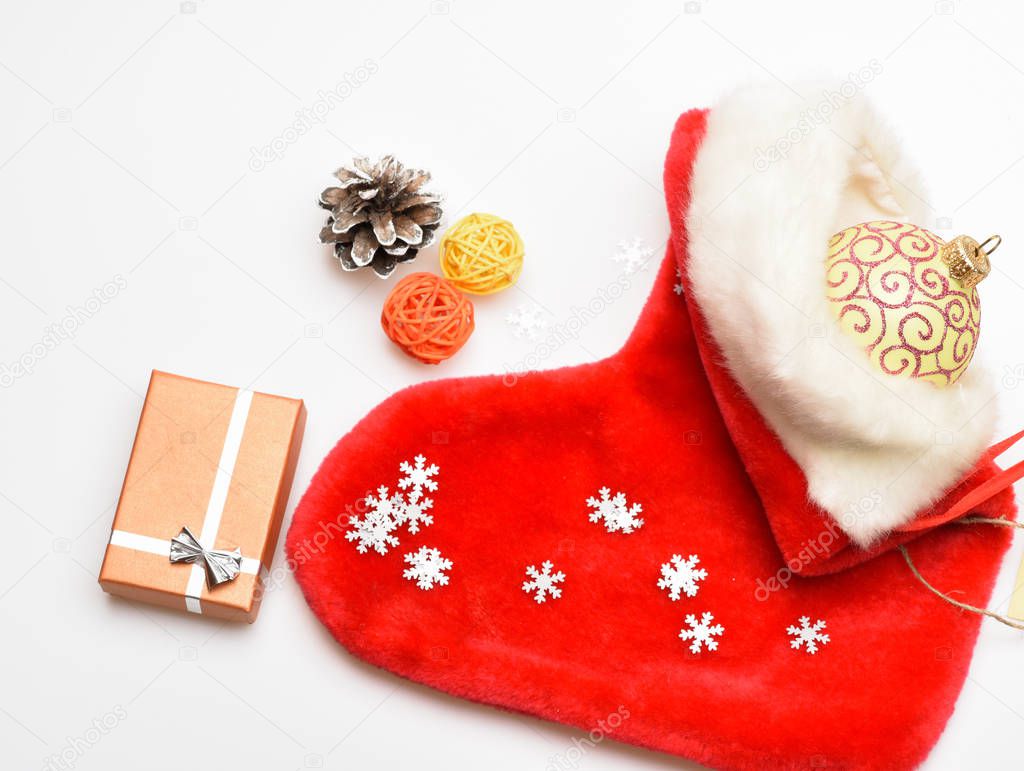 Fill sock with gifts or presents. Contents of christmas stocking. Christmas celebration. Christmas sock white background top view. Small items stocking stuffers or fillers little christmas gifts