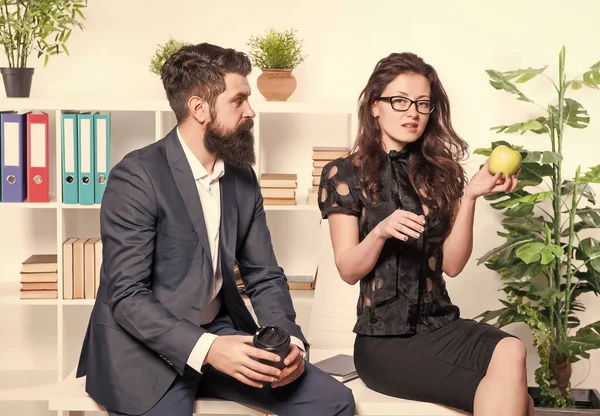 Office lunch. Man and woman conversation during lunch time. Office rumors. Couple coworkers relax lunch break. Share lunch with with colleague. Flirting colleagues. Bearded man and attractive woman