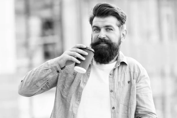 Few more sips. Bearded man enjoy drinking coffee outdoor. Hipster hold takeaway hot beverage cup. Drinking tea habit. Drinking cocoa. Refresh and keep drinking — ストック写真