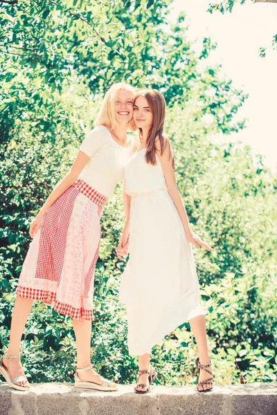Friendly relations. Summer rest. Revelation and sincerity. Carefree youth friends hang out outdoors. Girls friends summer dress outfit nature background. Summer vacation and relax. Friendship concept — 스톡 사진