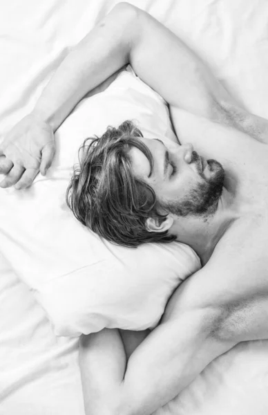 How much sleep you actually need. Bearded man sleeping face relaxing on pillow. Man handsome guy lay in bed. Get adequate and consistent amount of sleep every night. Expert tips on sleeping better — Stock Photo, Image