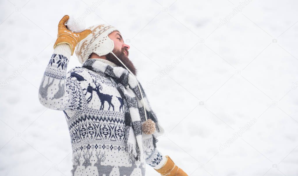 Happy holiday. bearded man in warm clothes. Happy new year. winter season. Christmas snow activity. winter holiday. Morning before xmas. man having fun outdoor. happy hipster play snowballs