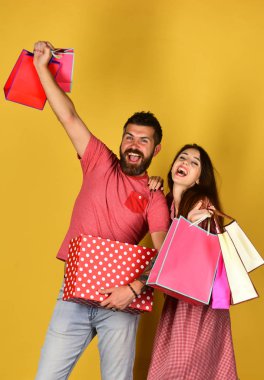 Man with beard holds polka dotted box. Shopping and spending clipart