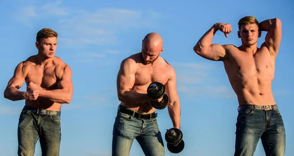 Fit your body. sportsman men training outdoor. sport coach use barbell or dumbbells. gym equipment. healthy and energetic. bodybuilding sport discipline. fit and strong. three muscular bodybuilders — Stock Photo, Image
