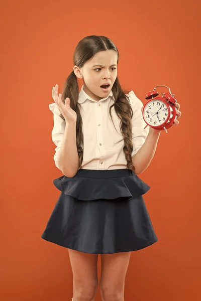 Classes begin. Developing discipline. Time for break and relax. Vacation time. Elementary school day bell schedule. Schooltime concept. Avoid being late. Schoolgirl hold alarm clock. Time to study — Stock Photo, Image