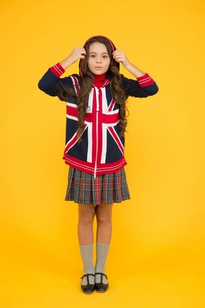 Learn english language. Girl school uniform. English student. Education and upbringing. Language school. English kid yellow background. British accent. Great Britain flag. International exchange