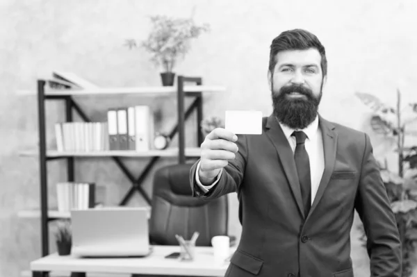 Card design. Call now. Guy formal suit stand in office. Accountant or banker. Businessman hold blank card. Useful contacts. Bearded hipster top manager show card. Banking services for small business