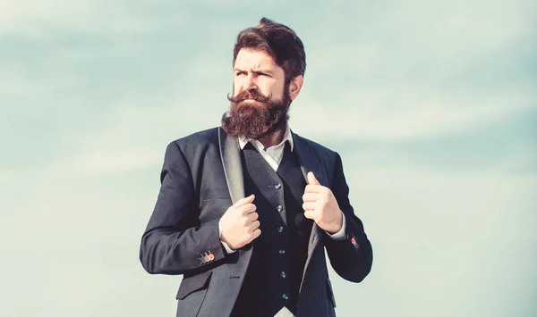 Facial hair beard and mustache care. Beard fashion trend. Start with grooming routine and ultimately lead better world. Man bearded hipster wear formal suit blue sky background. Vintage style beard