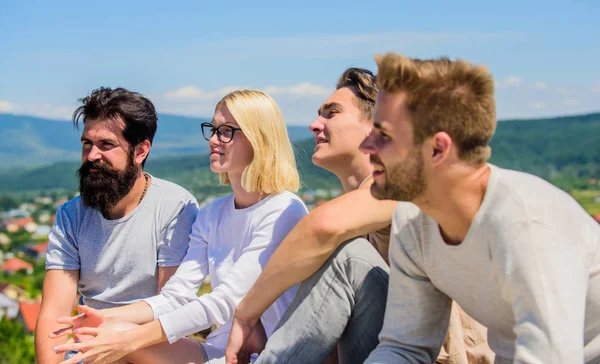 Carefree time together. Group of people in casual wear. diverse young people talking together. best friends. Summer vacation. group of four people. great fit for day off. happy men and girl relax