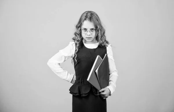 Serious small girl wants to be teacher. notebook for diary notes. study lesson. knowledge and education. Back to school. hometwork. small girl with paper folder. Really busy. busy because of homework — Stock Photo, Image