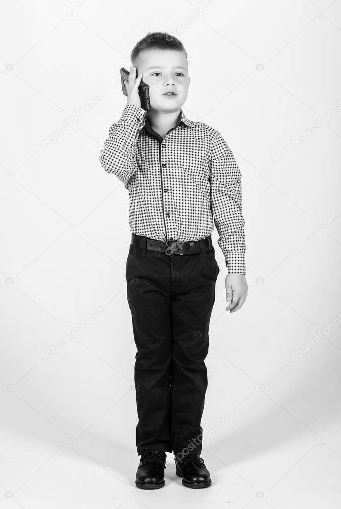 Businessman. Office life. Conversation. little boss. Ceo direstor. childhood. Business communication. confident child has business start up. Modern life. small boy with mobile phone. Successful kid