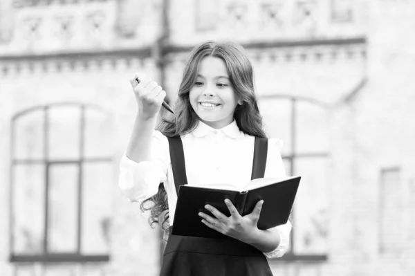 Towards knowledge. Students life. School student. Intelligent child. Intellectual task. Cognitive process. Start new school project. Welcome back to school. School girl formal uniform hold book — Stock Photo, Image