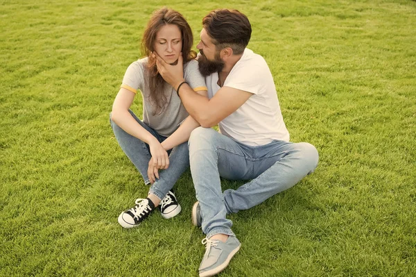 Couple spend time in nature. Couple in love relaxing on green lawn. Simple happiness. Couple relations goals. Playful girlfriend and boyfriend dating. Summer vacation. Lovely couple outdoors