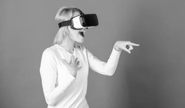 Woman excited using 3d goggles. Funny woman experiencing 3D gadget technology - close up. Woman with virtual reality headset. Interfaces.