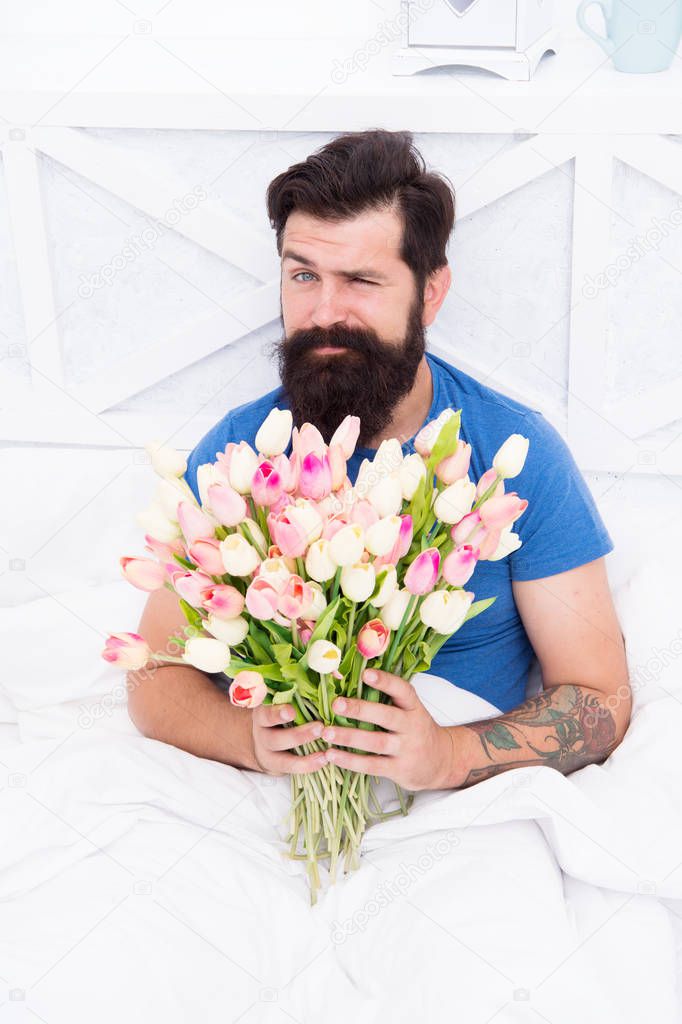 Hot day. tulip flower for march 8. good morning flowers. positive mood and happiness. winking bearded man in bed. happy birthday gift bouquet. spring fresh tulip. love valentines day. womens day