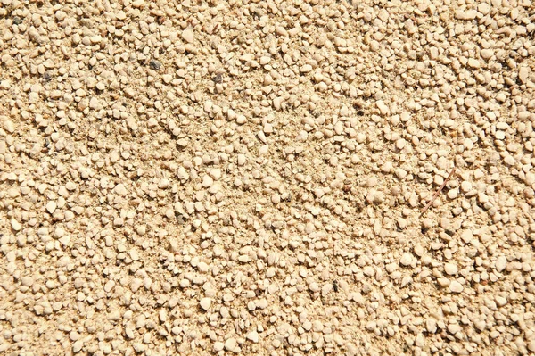 Rough and uneven. Sand and stone surface. Sandy stone texture. Gravel pebble or rock fragments. Stone ground. Abstract stone background for wallpaper — Stock Photo, Image