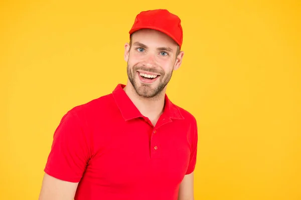 Supermarket cashier. Man delivery service wear red cap. Shop assistant. Food order delivery man. Cashier occupation. Hiring shop worker. Handsome guy cashier uniform. Restaurant cafe staff wanted — Stock Photo, Image