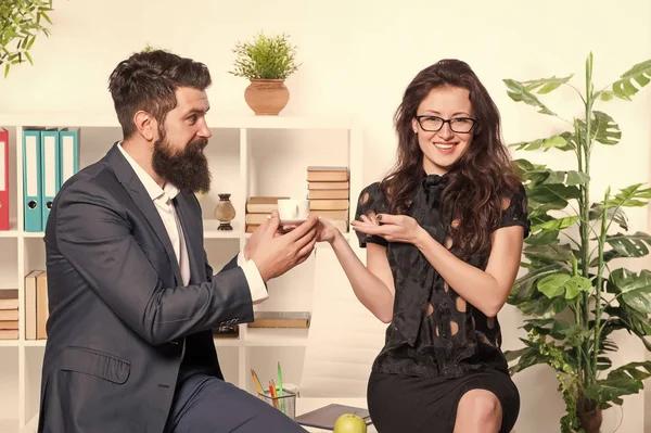 Bearded man and attractive woman. Man and woman conversation coffee time. Office rumors. Office coffee. Couple coworkers relax coffee break. Share coffee with with colleague. Flirting colleagues — Stock Photo, Image