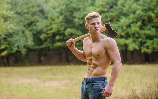 Doing his best. man strong body. muscular man with axe. sexy macho bare torso ax. brutal and attractive male in wood. bodybuilder show his muscles. power and strength. lumberjack carry axe — Stock Photo, Image