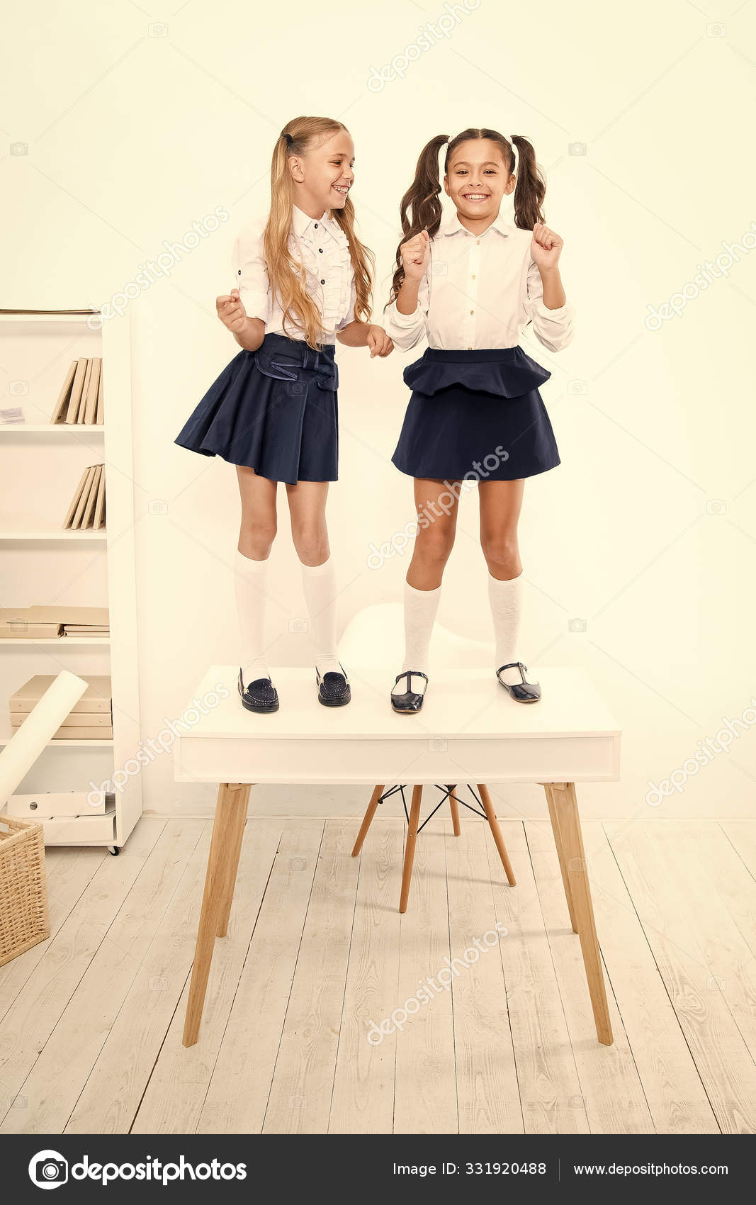 Back To School Style Happy Small Girls With Long Hair Styles Standing On Desk In Class Little Children Smiling In School Style Giving School Fashion A Sense Of Style Stock Photo Back To School Style Happy Small Girls With Long Hair Styles Standing On Desk In Class Little Children Smiling In School Style Giving School Fashion A Sense Of Style Stock Photo