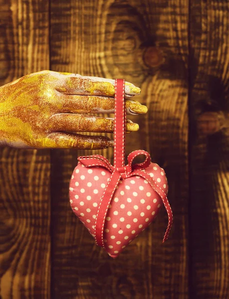 Female hand holding valentine heart — Stock Photo, Image