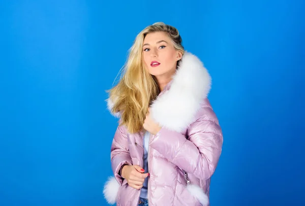 Winter clothes. Down jacket with furry hood. Girl wear winter jacket. Winter season. Soft fur. For those wishing stay modern. Fashion environmental awareness. Faux fur is more than just trend