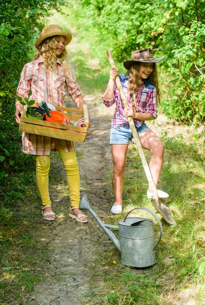 Kids girls with tools for gardening. Gardening basics. Gardening teaching life cycle process. Summer at countryside. Gardens great place cultivate meaningful and fun learning experience for children — Stock Photo, Image