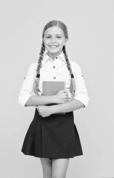 School lesson. Study literature. Inspirational quotes motivate kids for academic year ahead. School girl formal uniform hold book. Towards knowledge. Learn following rules. Welcome back to school — Stock Photo, Image